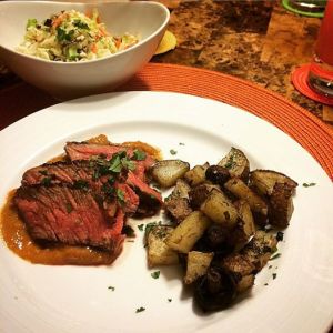 Marinated steak served over a mango sauce, along with roasted potatoes and mushrooms, YUM!